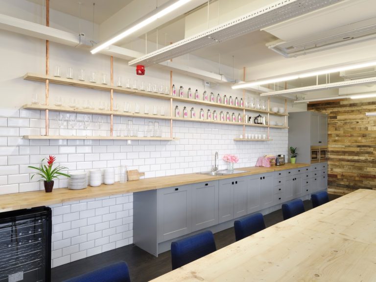 Yoyo Wallet refurbished office kitchen with grey units and white metro tiles